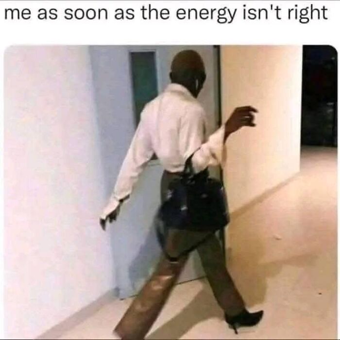 Person in high heels quickly leaving a hallway, capturing a funny meme moment.