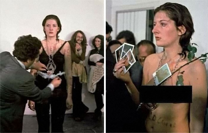 A woman involved in an art performance, surrounded by people, showcasing forgotten corners of history.