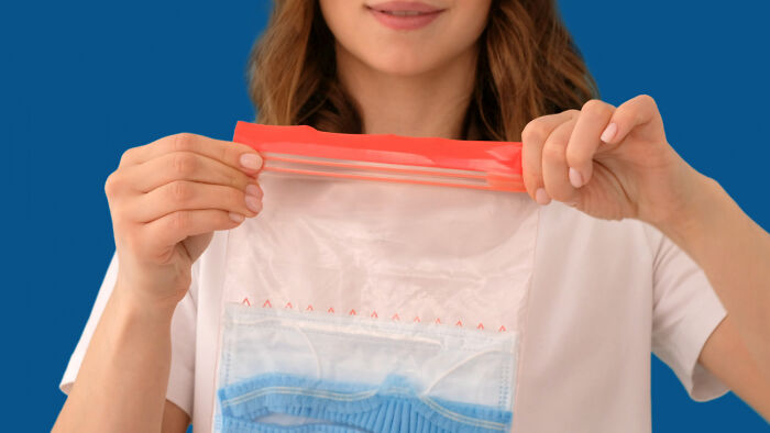 Person holding a resealable plastic bag, illustrating an appreciation for "old people" habits.