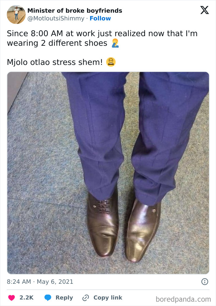 Person at work realizes they're wearing mismatched shoes, highlighting a challenging day.