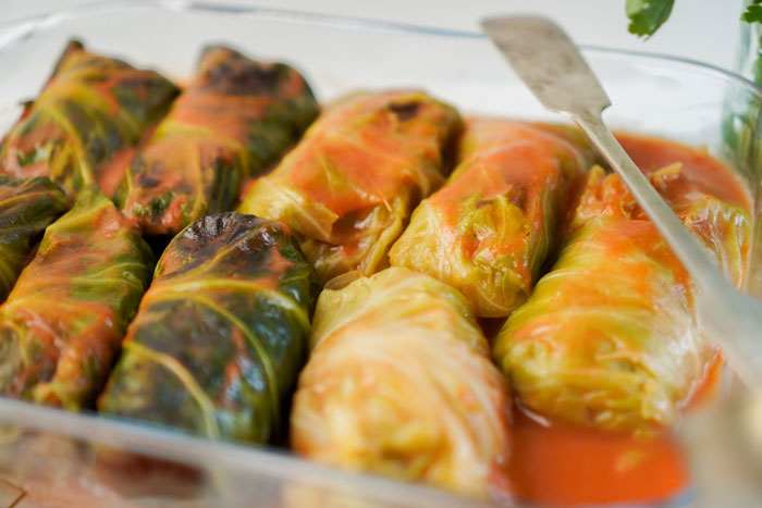 Old-school delicacy of stuffed cabbage rolls in tomato sauce, showcasing nostalgic flavors from the past.