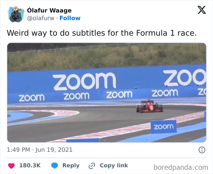 Racecar on a track with blue "Zoom" banners; example of work-related humor meme.