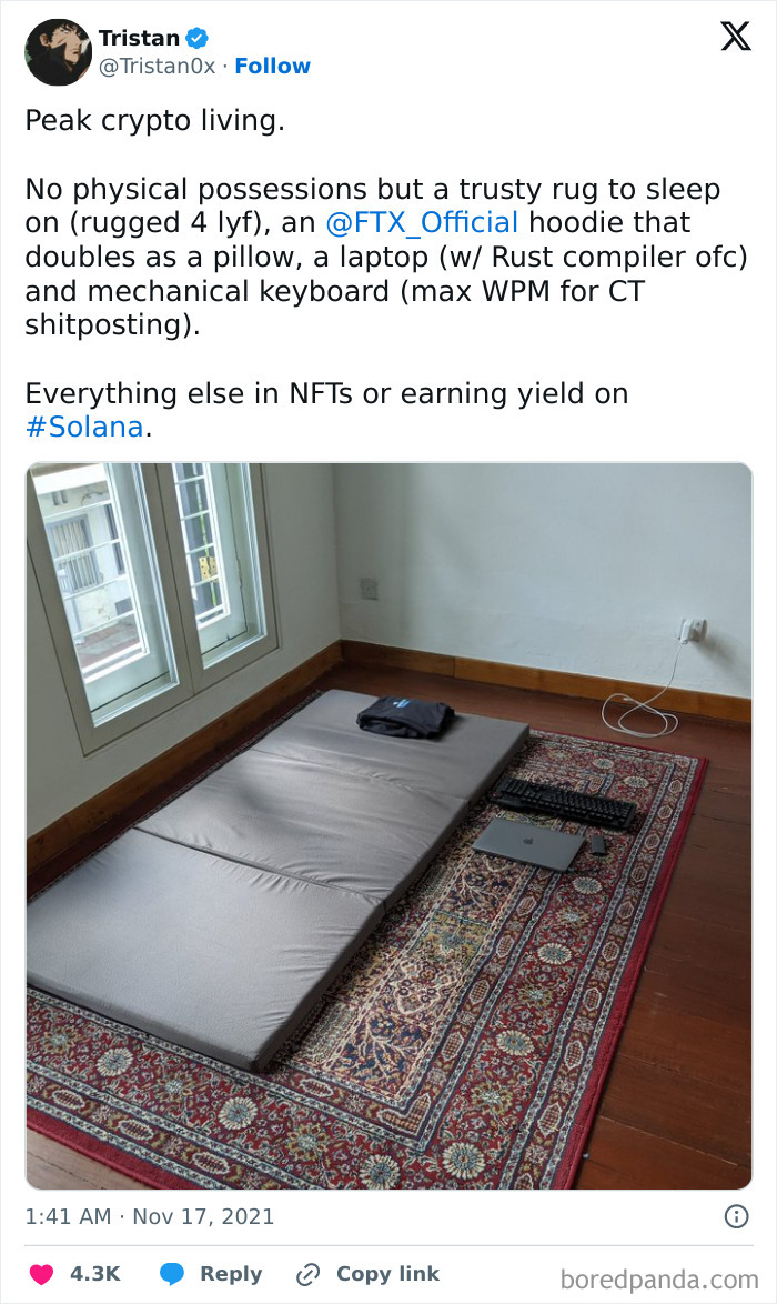 Cringe-worthy minimalist crypto setup with a mat, rug, laptop, and keyboard in a sparse room.