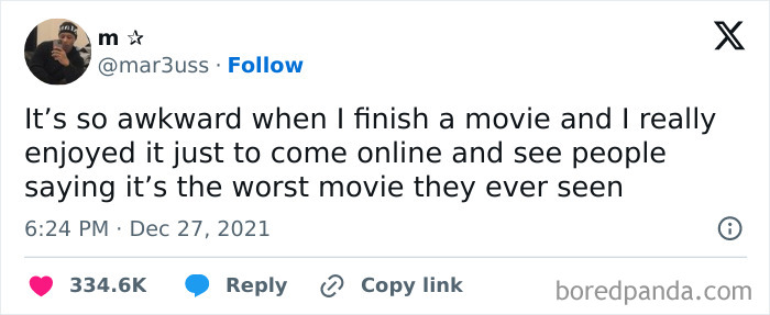 Tweet about awkward life moment enjoying a movie others disliked, showing varied opinions online.