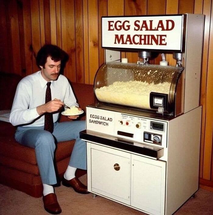 Man eating in front of retro egg salad machine, highlighting forgotten corners of history.