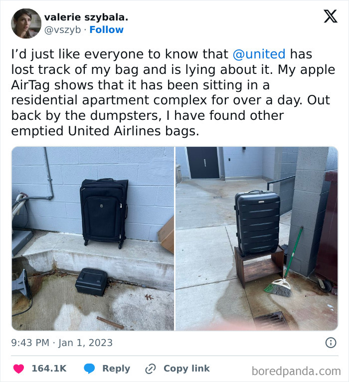 Lost airline baggage found near dumpsters in an apartment complex.