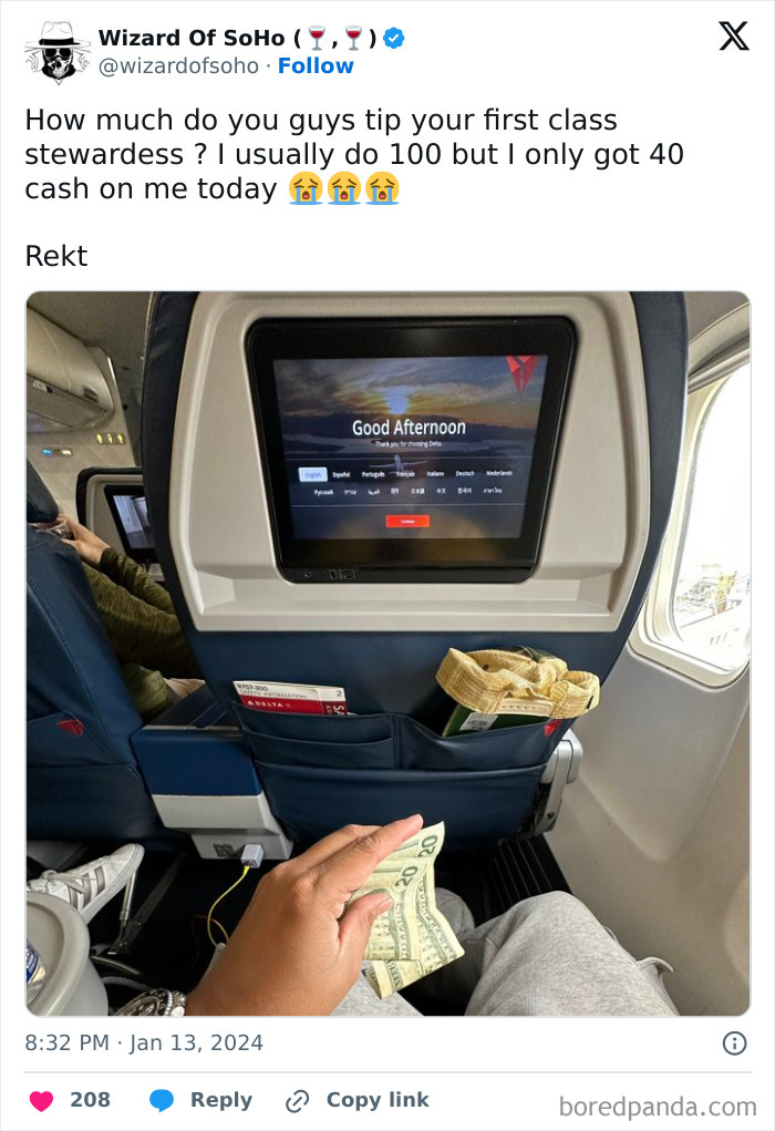 Person in first class holding cash, highlighting a tweet discussing tipping stewardess in a humorous context about wealth.