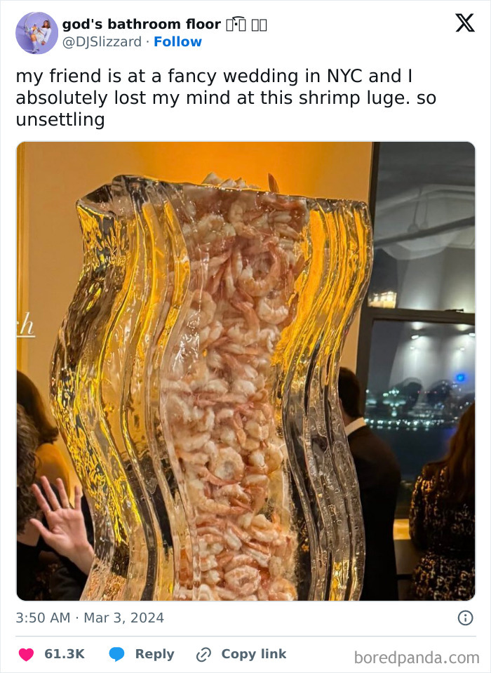 Shrimp luge display at a wedding buffet table, creating pure chaos on a plate with an unsettling presentation.