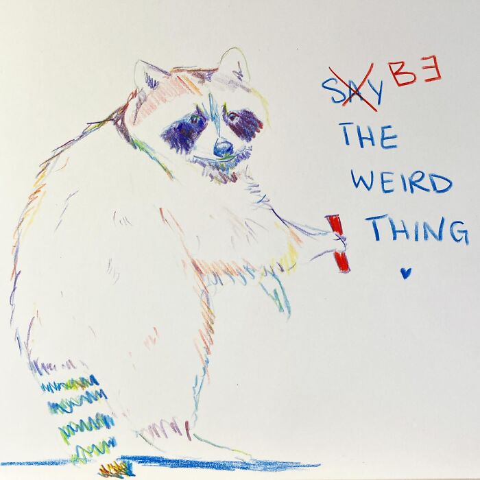 Raccoon watercolor painting with pop culture reference, holding a red item, text says "Be The Weird Thing."