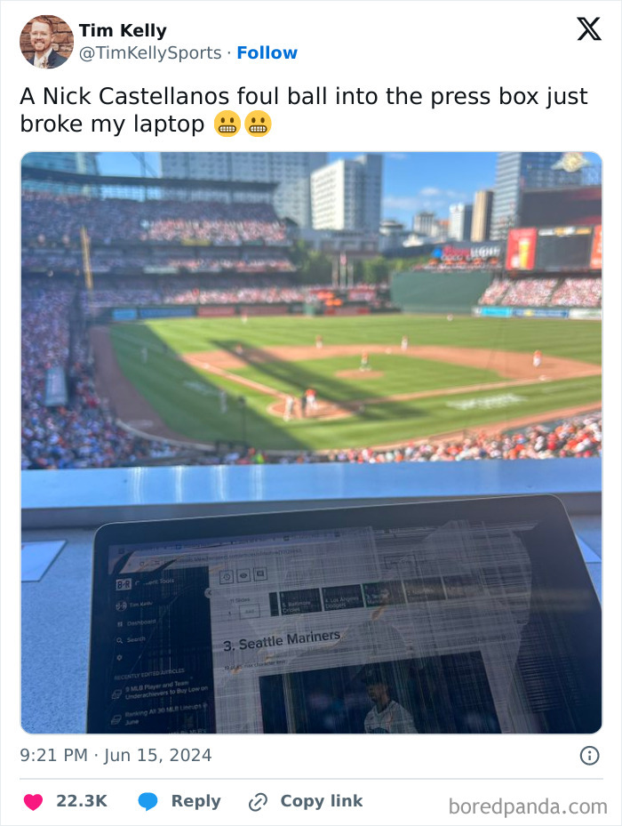 A broken laptop screen at a baseball game shows an expensive accident in the press box.