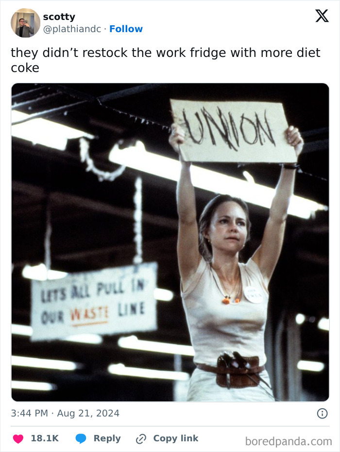 Woman holding "Union" sign in factory, illustrating a funny work tweet about empty fridge.