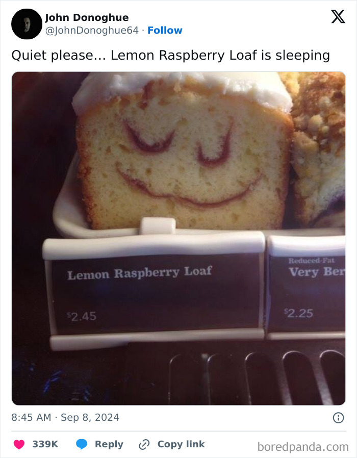 Lemon raspberry loaf with a frosting face, labeled in a bakery display, showcasing a humorous middle class fancy meme.