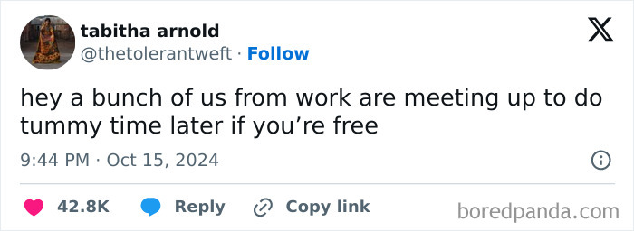 Tweet joking about work colleagues meeting for "tummy time," implying humorous work-related banter.