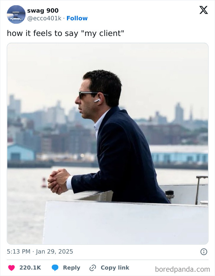 Man in a suit with earbuds, looking contemplative over city skyline, humorously captioned work tweet.
