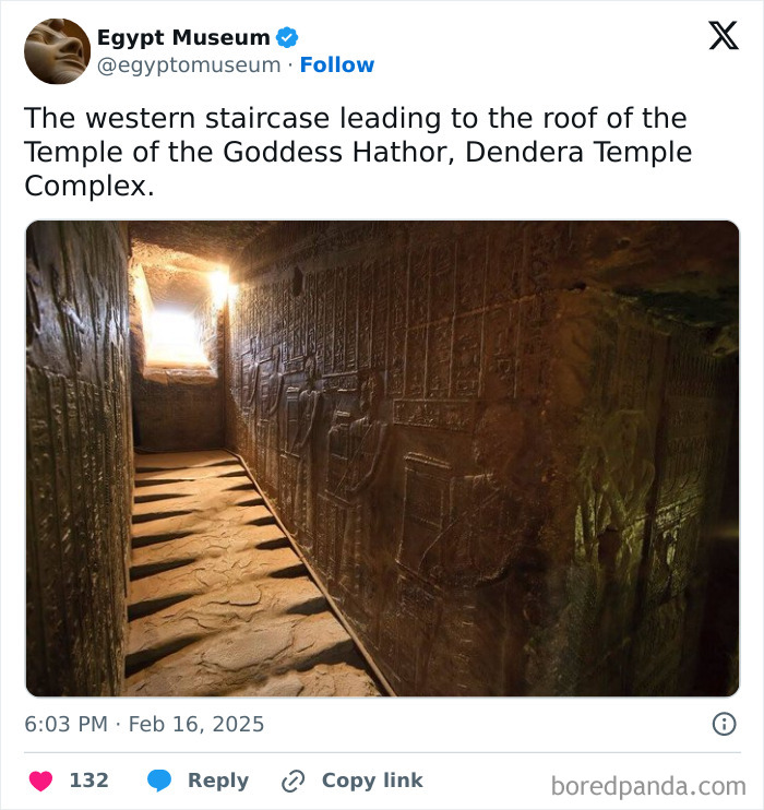 Ancient Egyptian artifacts adorn the walls of the Dendera Temple's staircase.