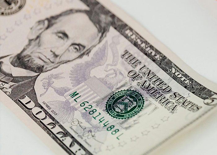 US five-dollar bill with Lincoln portrait, representing things Gen X misses without social media.