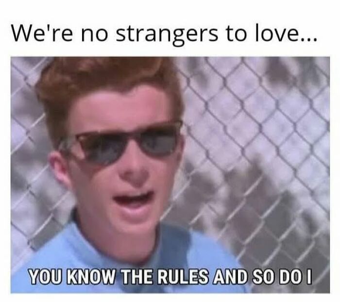 Man singing with sunglasses, delivering a literal meme about knowing rules in love, with a chain-link fence backdrop.