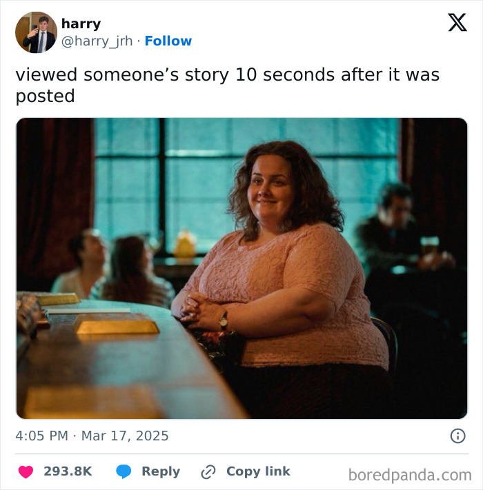 Woman in pink top sitting at a table, smiling in a dimly lit room, embodying generational wealth humor for March.