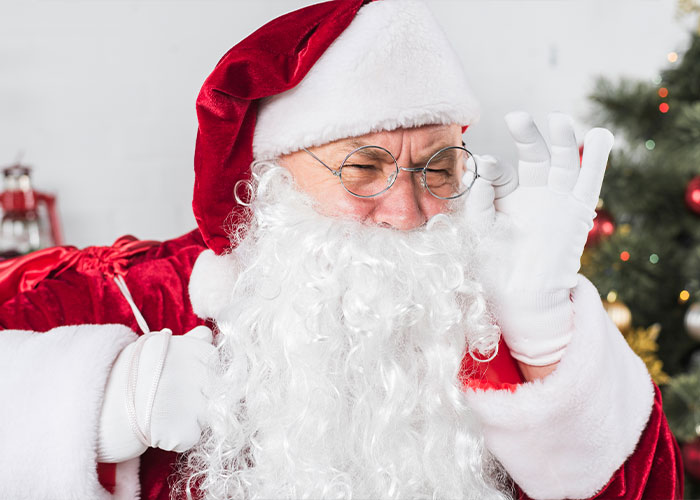 Santa Claus adjusting glasses, embodying a memorable dad character.