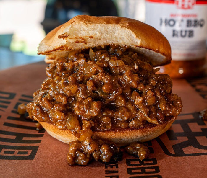 Hearty old-school delicacy sandwich with savory meat filling on a toasted bun.