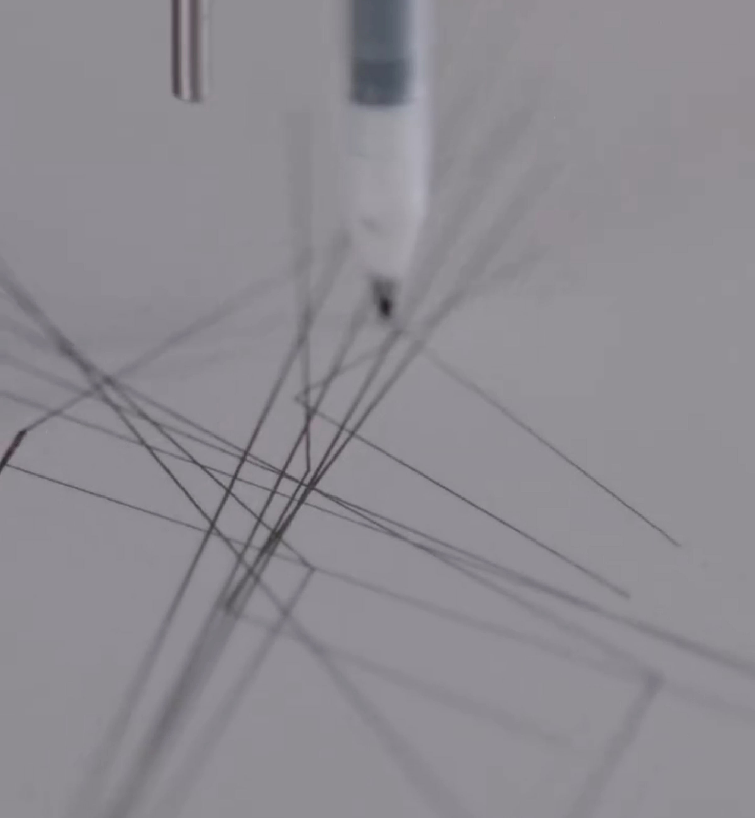 Tattoo machine drawing intricate lines inspired by brain activity imprint.