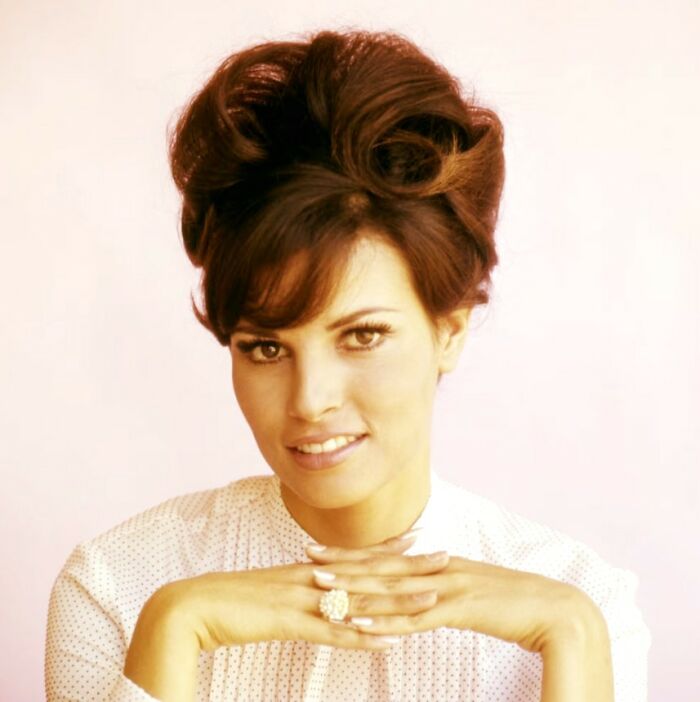 Elegant woman with styled hair and a white blouse, representing a moment in lesser-known historical pics.