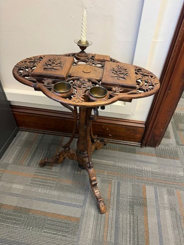 Intricate wooden stand with candle, brass holders, and floral carvings, thrifting find.
