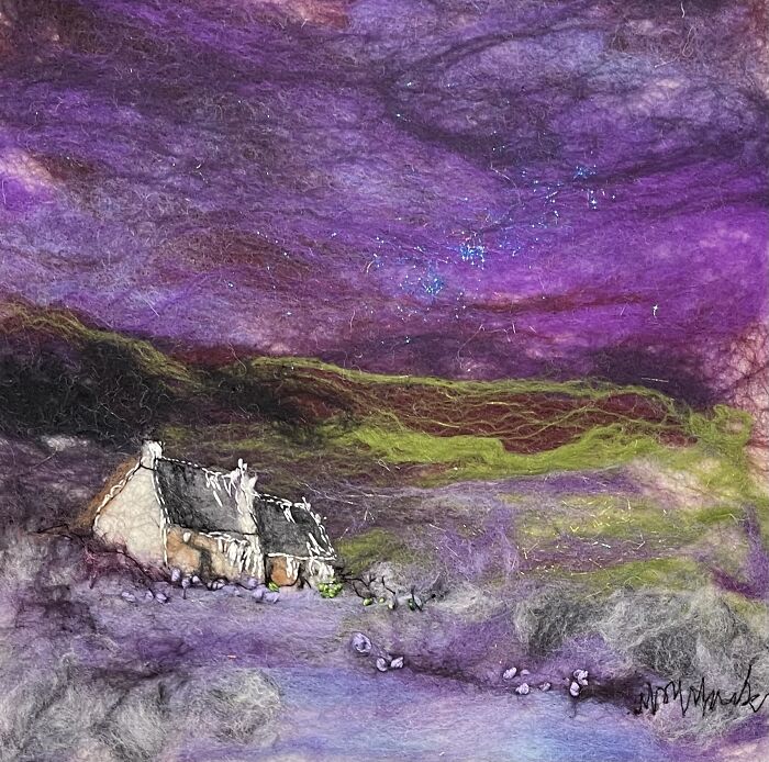 Fiber artwork by Moy Mackay depicting a cottage under a vivid purple sky.
