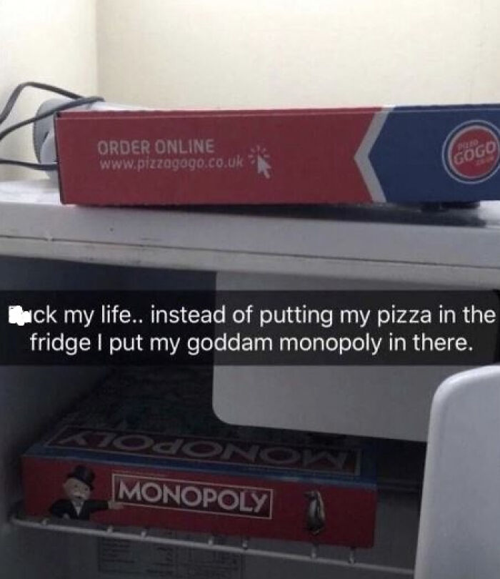 Pizza box on the counter, Monopoly board in the fridge with humorous text, capturing the essence of random memes.