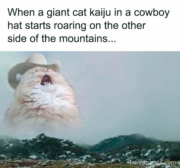 Giant cat kaiju wearing a cowboy hat roars over mountains, embodying a literal meme humor.