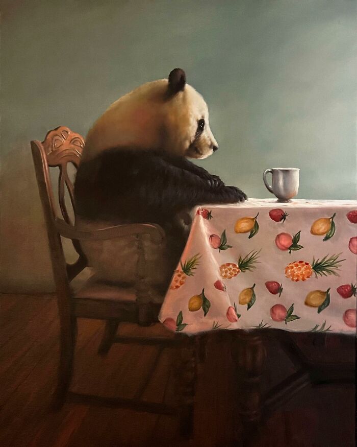 Anthropomorphic artwork of a panda sitting at a table with a cup, covered with a fruit-patterned tablecloth.