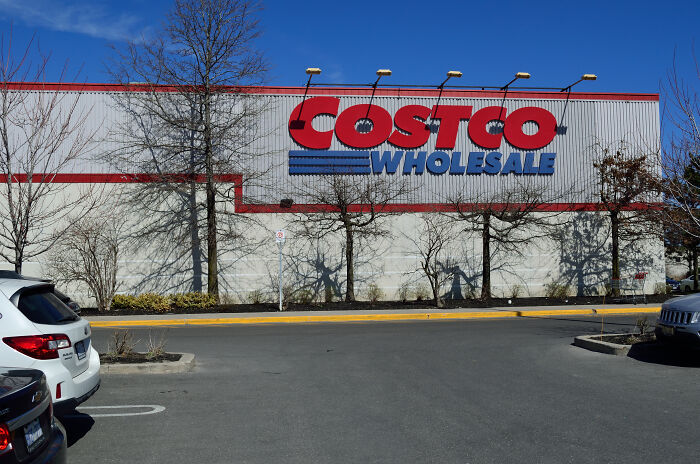 Costco Wholesale storefront, showcasing a valuable membership option in a parking lot setting.