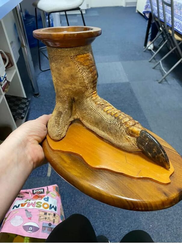 Unusual thrift store find: a wooden stand resembling a bird claw.