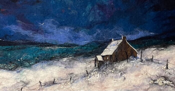 Fiber art depicting a snowy landscape with a cottage and night sky by Moy Mackay.