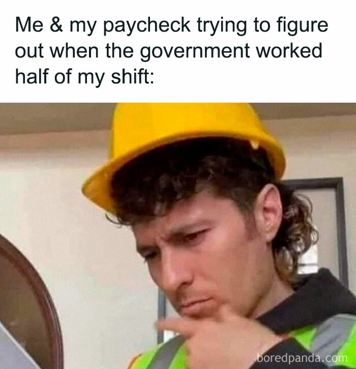 A worker in a hard hat and reflective vest pondering paycheck deductions; relatable job meme.
