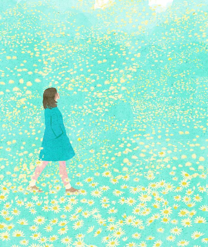 A woman in a blue coat walks through a serene field of daisies, illustrating solitude.