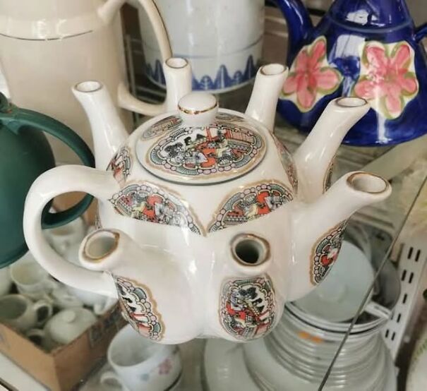Unique multi-spout teapot with intricate designs, found while thrifting among other colorful teapots.