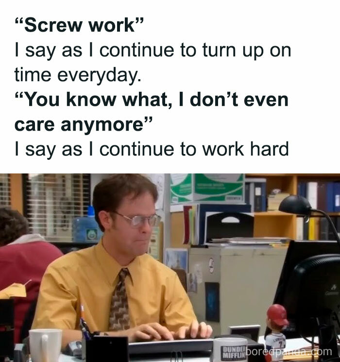 Office worker at a desk, humorously expressing frustration with job, yet continues working diligently—relatable work meme.