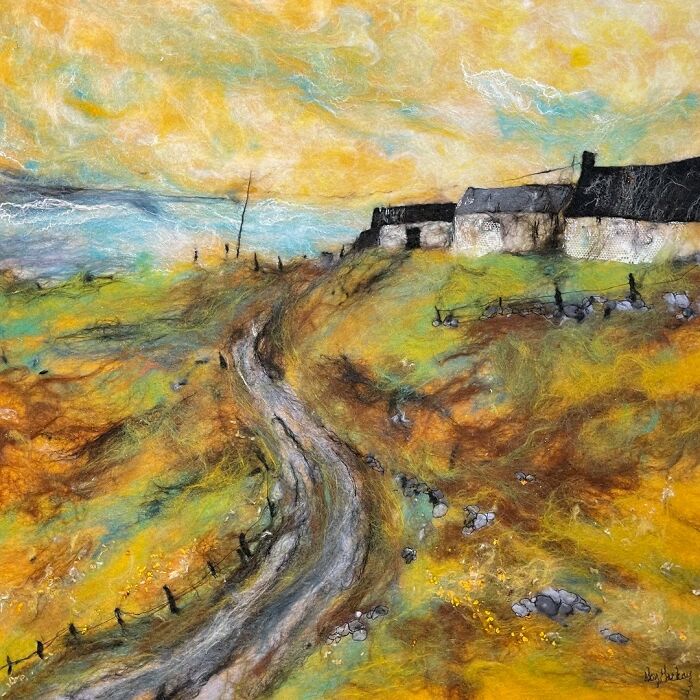 Fiber art landscape by Moy Mackay depicting a scenic path among cottages under a vibrant sky.