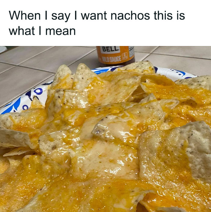 Cheesy nachos piled on a plate with sauce, a humorous food-related meme in the background.