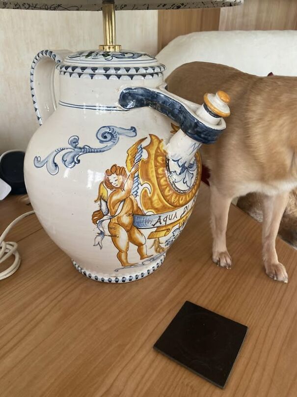 Ornate ceramic lamp resembling a vintage teapot with cherub design, spotted while thrifting.