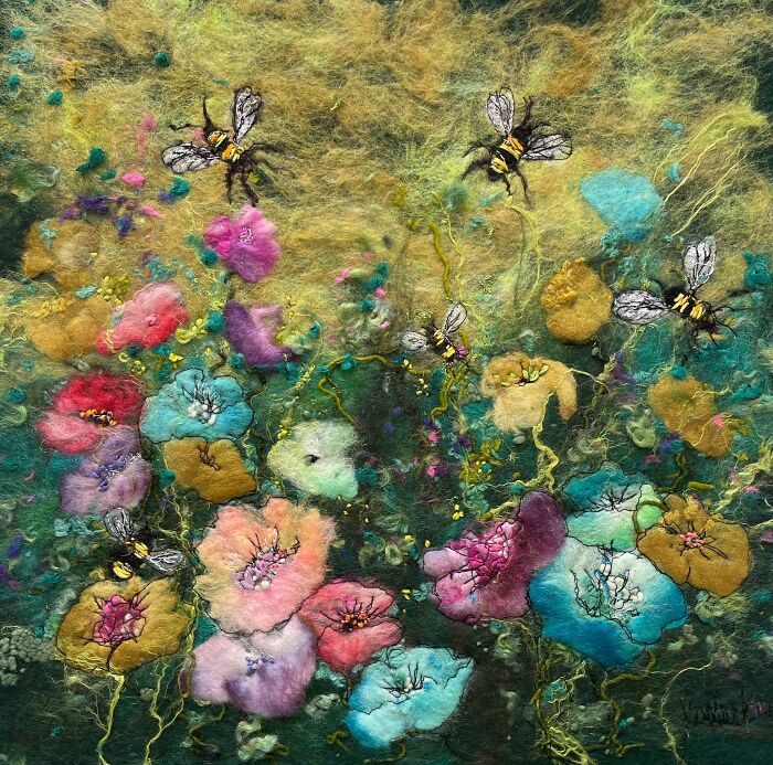 Fiber art landscape by Moy Mackay with colorful flowers and bees.