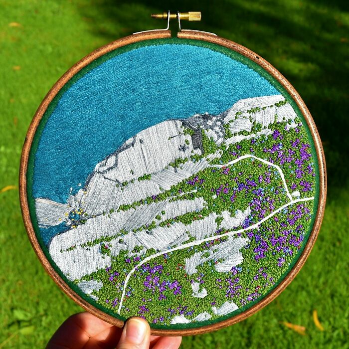 Landscape embroidery art with mountains and greenery by Victoria Rose Richards.