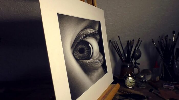 3D drawing of a realistic eye on an easel, by a professional German artist, surrounded by art tools.
