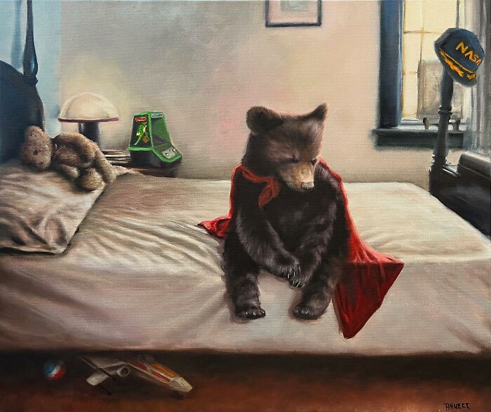 Bear wearing a red cape, sitting on a bed with teddy bear and toys, depicting anthropomorphic art by Richard Ahnert.