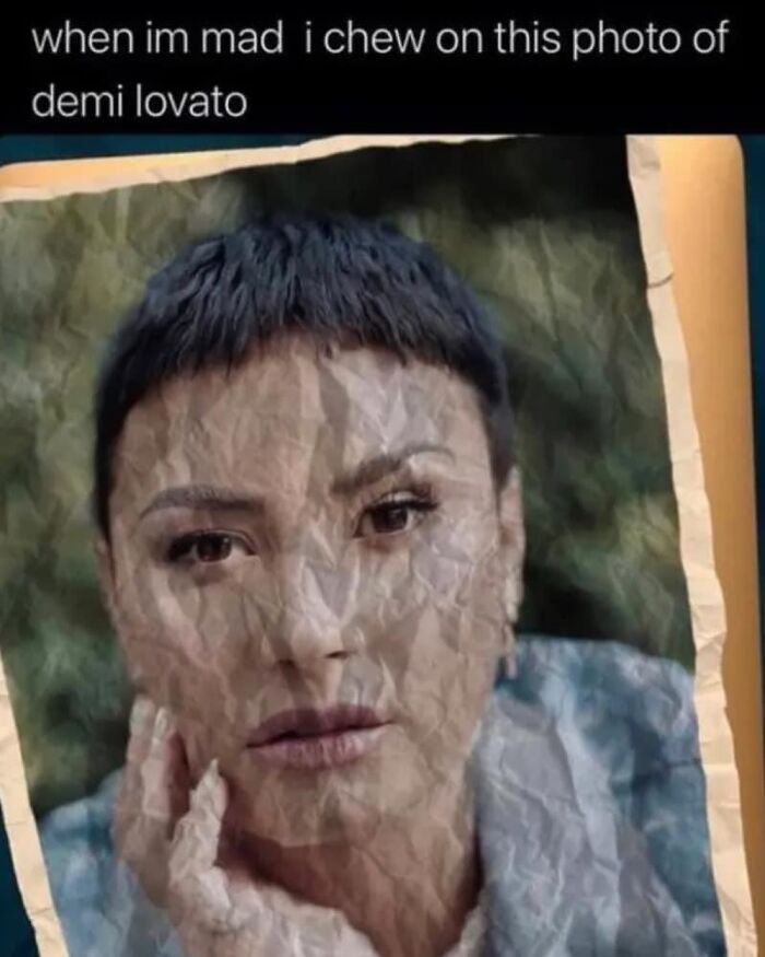 Crumpled, chewed photo with a funny caption about stress relief, featuring a well-known person.