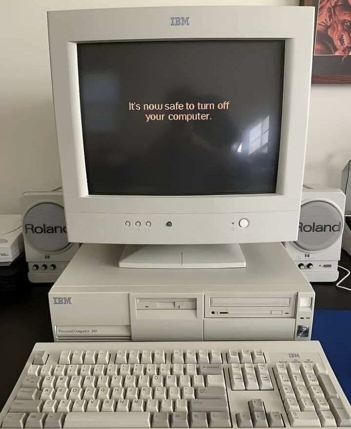Retro IBM computer displaying "It's now safe to turn off your computer." Funny vintage tech setup.