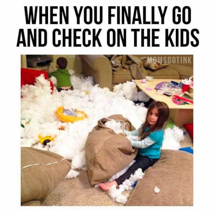 Kids surrounded by couch stuffing, creating a parenting meme scene of joyful chaos in the living room.