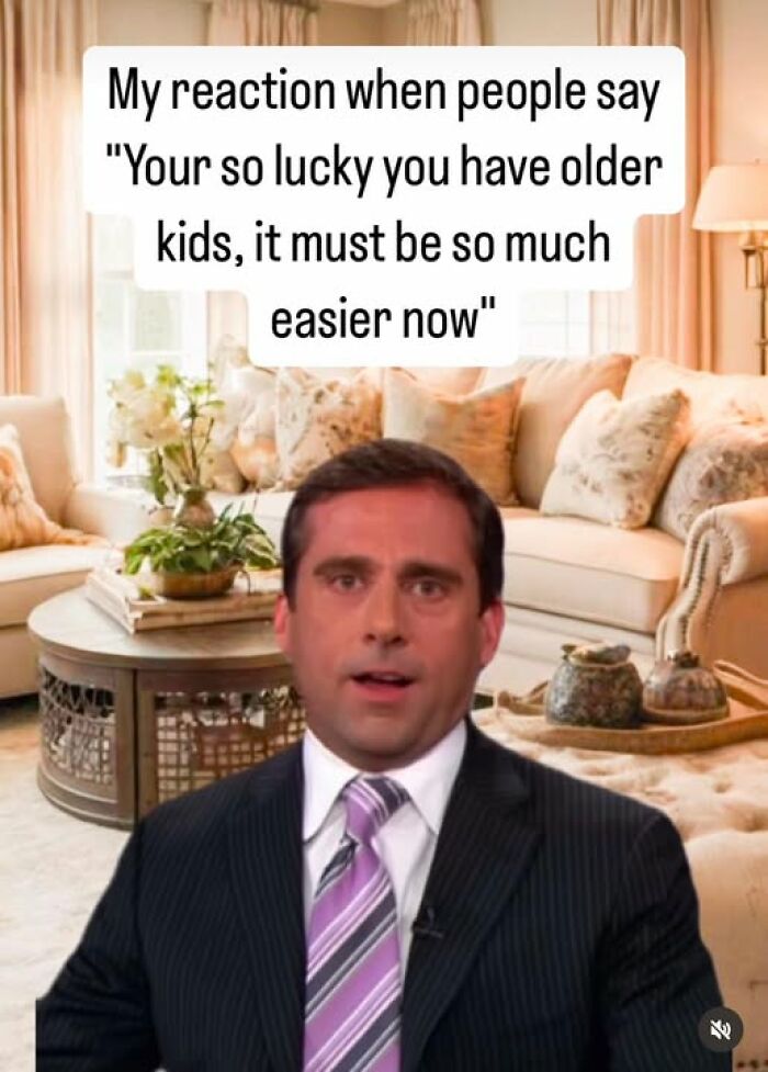 Man in suit with humorous expression, reacting to a parenting comment about having older kids being easier.