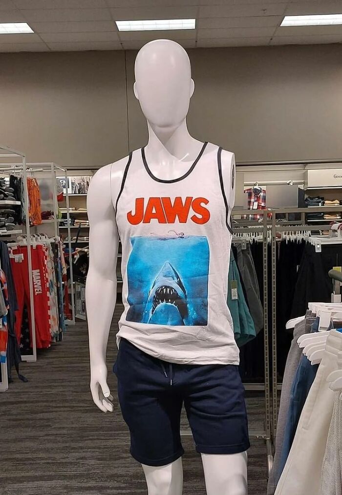 Mannequin in a store wearing a "Jaws" tank top, creating a funny random scene without context.
